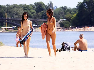 Petite nudist teenager enjoys a beautiful day at the beach